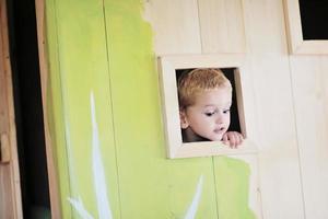 happy child in a window photo