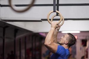 man doing dipping exercise photo