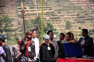 Dieng, Indonesia - August 1, 2015. Dieng Culture Festival, Tourists follow the dreadlocks procession during the Dieng Culture Festival event at Dieng, Banjarnegara district, Central Java photo