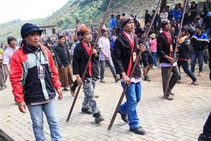 Dieng, Indonesia - August 1, 2015. Dieng Culture Festival, Tourists follow the dreadlocks procession during the Dieng Culture Festival event at Dieng, Banjarnegara district, Central Java photo