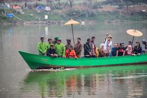 Dieng, Indonesia - August 1, 2015. Dieng Culture Festival, Tourists follow the dreadlocks procession during the Dieng Culture Festival event at Dieng, Banjarnegara district, Central Java photo