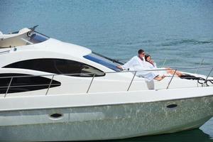 young couple on yacht photo