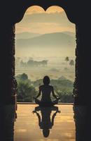 Silhouette of a beautiful Yoga woman in the morning - vintage style color effect