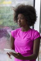 african american woman using tablet photo