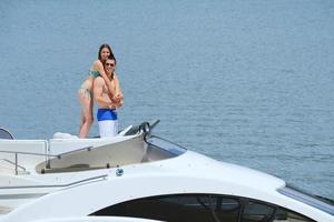 young couple on yacht photo