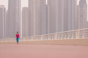 woman running on the promenade photo