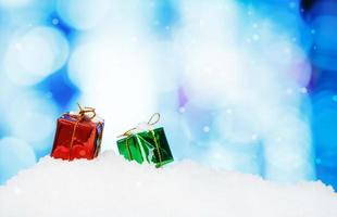 Gift Box and christmas decoration on abstract background and snowflakes photo