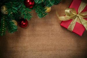 Christmas fir tree on wooden board background with copy space photo