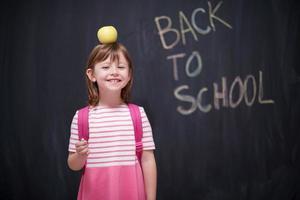 child holding apple on head photo