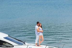 young couple on yacht photo