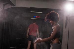 black woman preparing for climbing workout photo