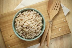 Brown Rice on Wooden Plate photo