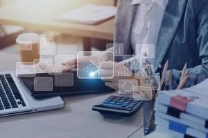 Big data analytics and business intelligence concept with chart and graph icons on a digital screen interface and a businessman hand in background photo