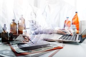 Medicine doctor and stethoscope touching icon medical network connection with modern interface on digital tablet in hospital background. Medical technology network concept photo