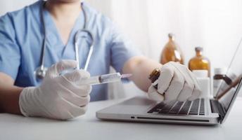 Medicine doctor and stethoscope touching icon medical network connection with modern interface on digital tablet in hospital background. Medical technology network concept photo