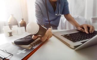 Medicine doctor and stethoscope touching icon medical network connection with modern interface on digital tablet in hospital background. Medical technology network concept photo