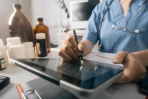 Medicine doctor and stethoscope touching icon medical network connection with modern interface on digital tablet in hospital background. Medical technology network concept photo