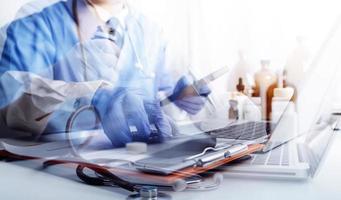 Medicine doctor and stethoscope touching icon medical network connection with modern interface on digital tablet in hospital background. Medical technology network concept photo