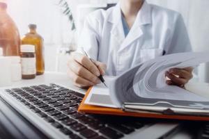 Medicine doctor and stethoscope touching icon medical network connection with modern interface on digital tablet in hospital background. Medical technology network concept photo