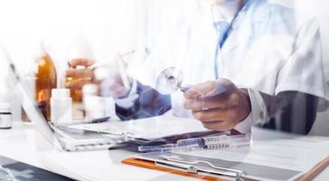 Medicine doctor and stethoscope touching icon medical network connection with modern interface on digital tablet in hospital background. Medical technology network concept photo