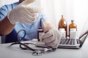 Medicine doctor and stethoscope touching icon medical network connection with modern interface on digital tablet in hospital background. Medical technology network concept photo