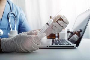 Medicine doctor and stethoscope touching icon medical network connection with modern interface on digital tablet in hospital background. Medical technology network concept photo