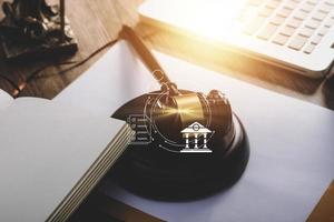 Business and lawyers discussing contract papers with brass scale on desk in office. Law, legal services, advice, justice and law concept picture with film grain effect photo