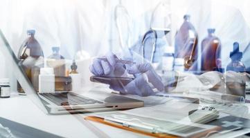 Medicine doctor and stethoscope touching icon medical network connection with modern interface on digital tablet in hospital background. Medical technology network concept photo