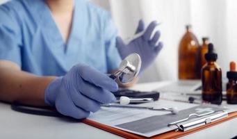 Medicine doctor and stethoscope touching icon medical network connection with modern interface on digital tablet in hospital background. Medical technology network concept photo