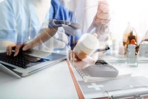 Medicine doctor and stethoscope touching icon medical network connection with modern interface on digital tablet in hospital background. Medical technology network concept photo