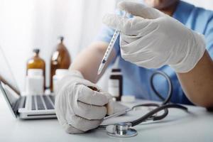 Medicine doctor and stethoscope touching icon medical network connection with modern interface on digital tablet in hospital background. Medical technology network concept photo