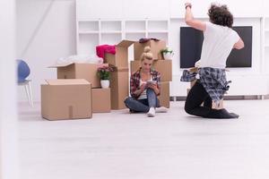 young couple moving  in new house photo