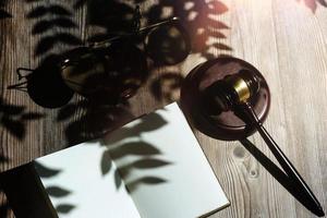 Business and lawyers discussing contract papers with brass scale on desk in office. Law, legal services, advice, justice and law concept picture with film grain effect photo