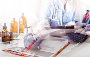 Medicine doctor and stethoscope touching icon medical network connection with modern interface on digital tablet in hospital background. Medical technology network concept photo