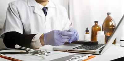 Medicine doctor and stethoscope touching icon medical network connection with modern interface on digital tablet in hospital background. Medical technology network concept photo