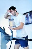 man running on the treadmill photo