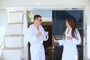 young couple on yacht photo