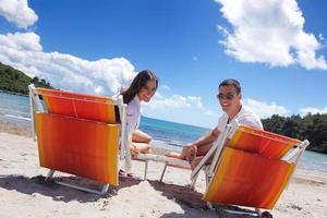 happy couple have fun on the beach photo