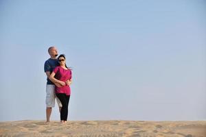 couple enjoying the sunset photo