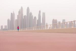 woman running on the promenade photo