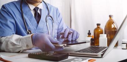 Medicine doctor and stethoscope touching icon medical network connection with modern interface on digital tablet in hospital background. Medical technology network concept photo