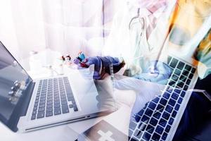 Medicine doctor and stethoscope touching icon medical network connection with modern interface on digital tablet in hospital background. Medical technology network concept photo