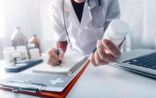 Medicine doctor and stethoscope touching icon medical network connection with modern interface on digital tablet in hospital background. Medical technology network concept photo