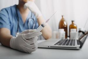 Medicine doctor and stethoscope touching icon medical network connection with modern interface on digital tablet in hospital background. Medical technology network concept photo