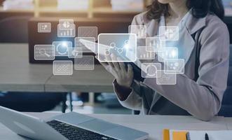 Big data analytics and business intelligence concept with chart and graph icons on a digital screen interface and a businessman hand in background photo