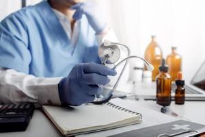 Medicine doctor and stethoscope touching icon medical network connection with modern interface on digital tablet in hospital background. Medical technology network concept photo