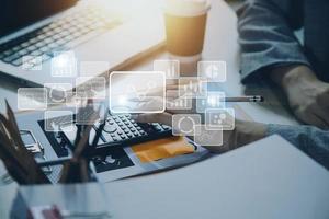 Big data analytics and business intelligence concept with chart and graph icons on a digital screen interface and a businessman hand in background photo