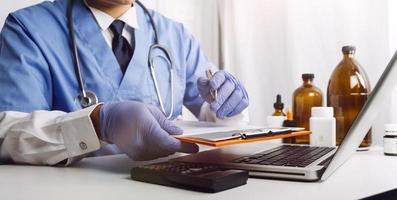 Medicine doctor and stethoscope touching icon medical network connection with modern interface on digital tablet in hospital background. Medical technology network concept photo