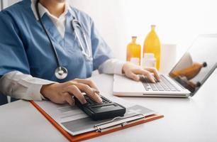 Medicine doctor and stethoscope touching icon medical network connection with modern interface on digital tablet in hospital background. Medical technology network concept photo
