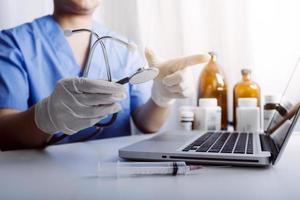 Medicine doctor and stethoscope touching icon medical network connection with modern interface on digital tablet in hospital background. Medical technology network concept photo